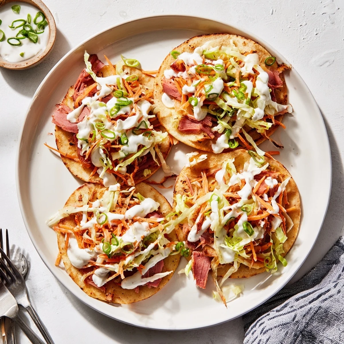 Warm flour tortillas cradling seasoned corned beef, crisp potatoes, and creamy coleslaw mixture