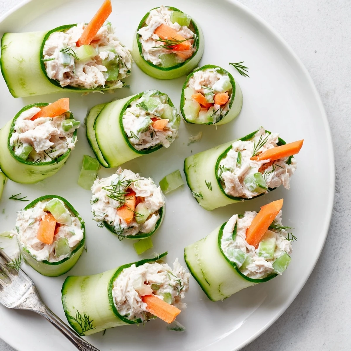 Crisp cucumber slices rolled with savory chicken salad make an easy low-carb lunch or snack