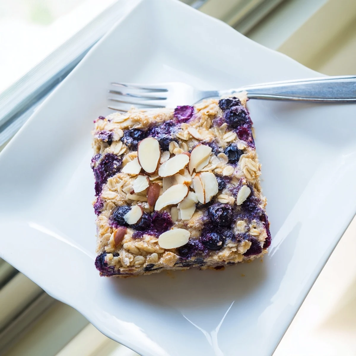 Fluffy blueberry cottage cheese breakfast bake fresh from the oven with nutty topping