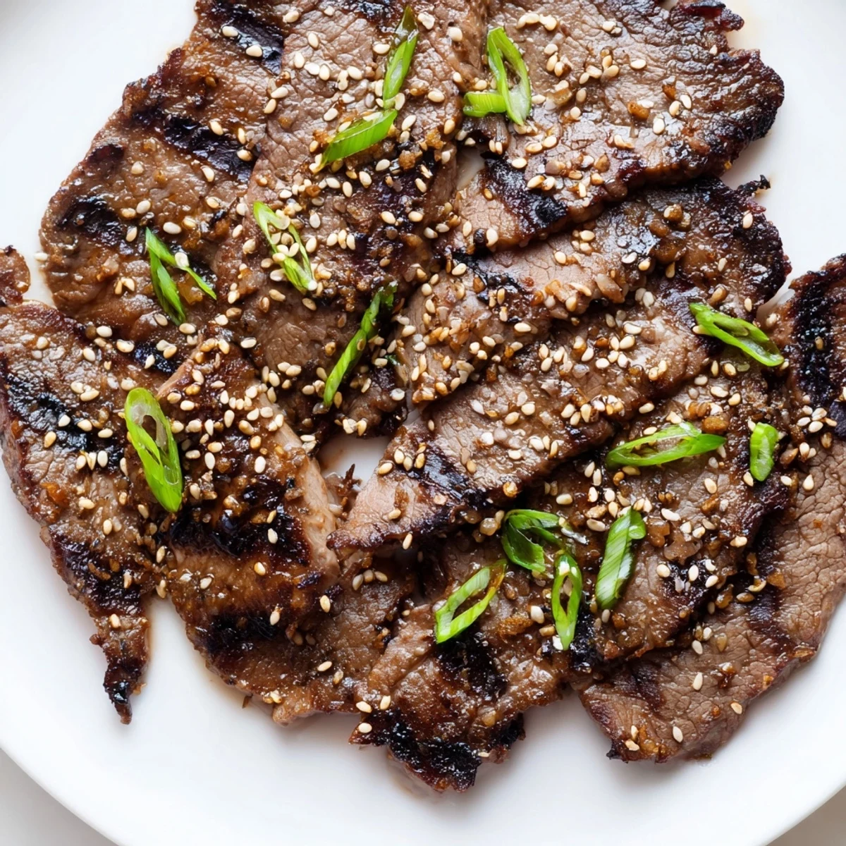 Thinly sliced Beef Yakiniku glazed in savory soy marinade served over fluffy steamed white rice