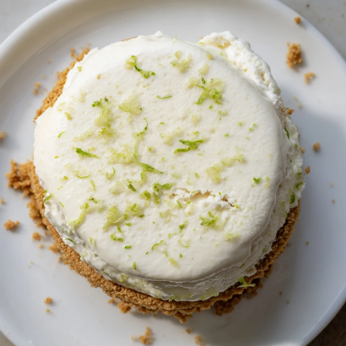 Chilled Key Lime Pie Ice Cream Sandwiches with crunchy graham edges and zest
