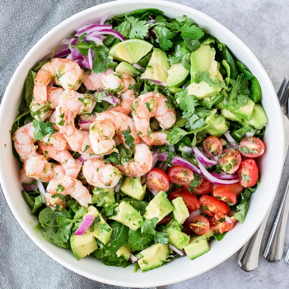 Fresh shrimp avocado salad recipe featuring tender seafood, creamy avocado cubes, and crisp greens in a light lime vinaigrette